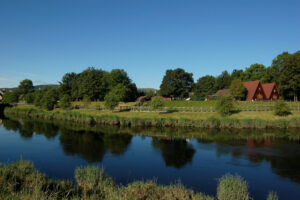 River Earn with lodges in the background