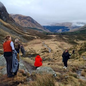 Family group having a picnic at Corrtie Fee, Glen Clova