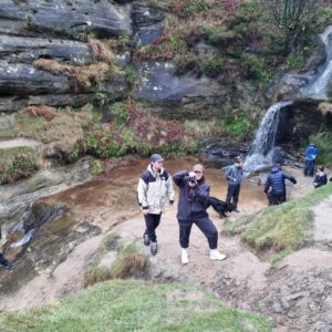 group of people at the waterfall by John Knox's Pulpit