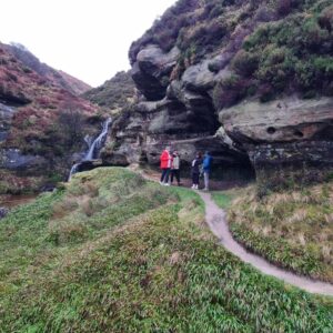 walkers exploring John Knox's Pulpit in fife