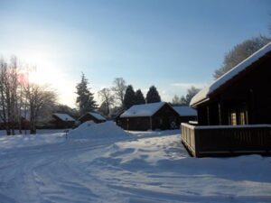 River Edge Lodges holiday park with lots of snow in the grounds